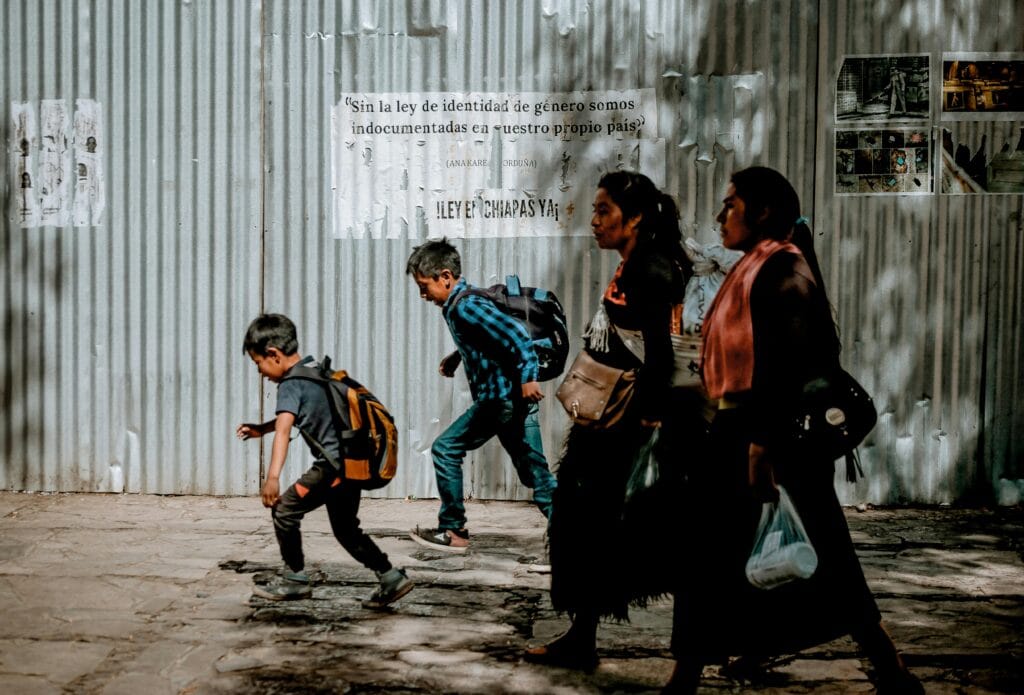 Family walking through shaded streets of San Cristóbal, Chiapas.
